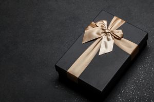 Black,Gift,Box,With,A,Golden,Ribbon,And,A,Large